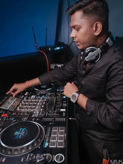 Focused and in the zone at a private event. My setup includes professional Pioneer DJ equipment to ensure the sound quality is perfect and the music never stops.