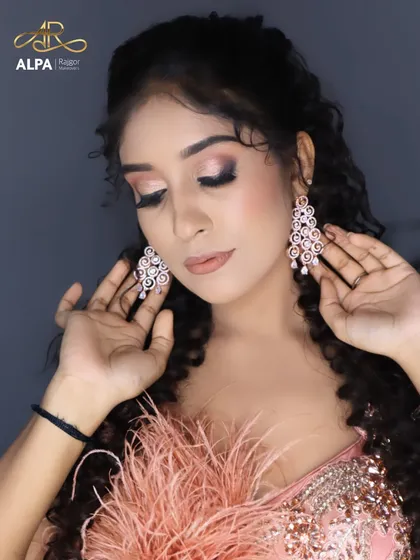 Highlighting the beautiful diamond earrings and the soft, blended eye makeup.