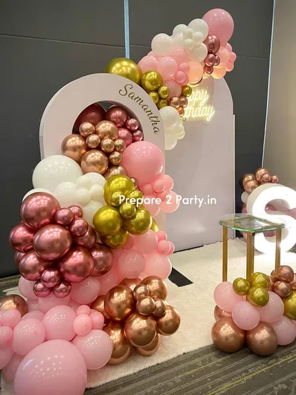 This angle highlights the layered effect of the balloon garland and the placement of the cake stand. We ensure every component is perfectly positioned for a balanced and photogenic result.