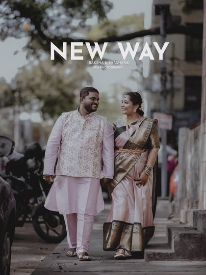 A different angle from the same urban engagement shoot, showing the couple walking together and sharing a look. It captures their journey in a modern setting.