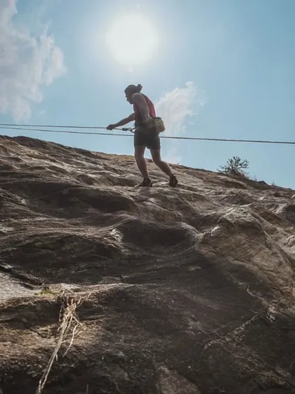 A powerful silhouette of Yogi against the sun as he navigates a multi pitch route. The "People of Romp" series showcases the personal journeys and achievements of our members.