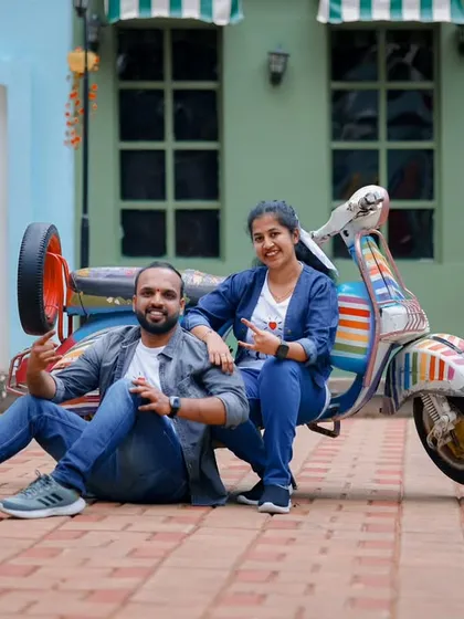 Let's have some fun! This casual pre-wedding shot with a colorful vintage scooter shows the playful and relaxed side of our photoshoots.