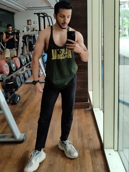 Posing in the gym. Confidence comes from putting in the work and seeing the results.