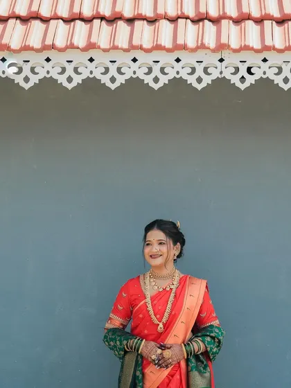 A beautiful portrait of a bride, her hands with my mehndi design held gracefully. The rich color of the henna complements her traditional jewelry and attire.