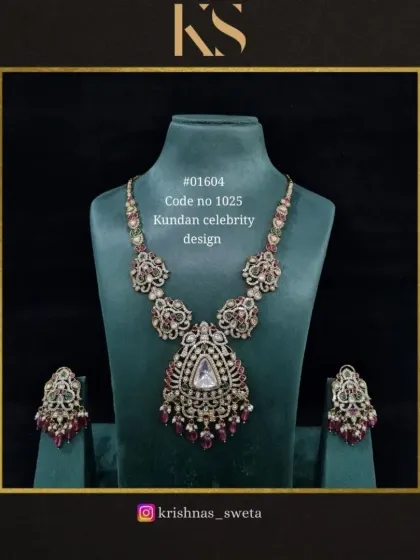 This Kundan celebrity design set with a mix of ruby colors is a warm and inviting piece. It's perfect for pairing with traditional silk sarees.