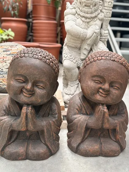 Meet our 'lucu' monks, guaranteed to bring a smile to your face. These charming figures, shown here in a rich brown finish, are perfect for adding a touch of lighthearted joy to shelves, desks, or garden nooks.