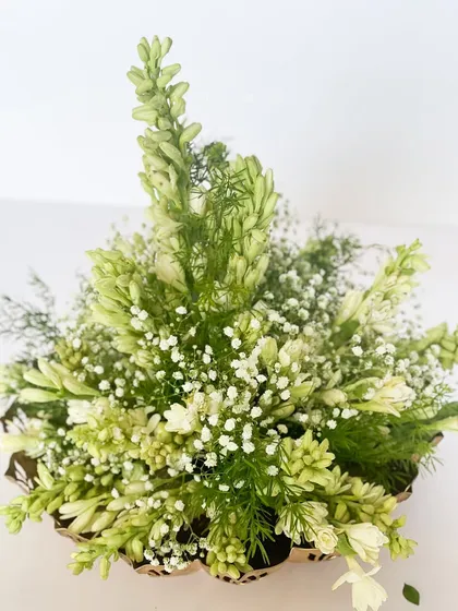 This hamper also includes a beautiful arrangement of fresh Tuberose (Rajnigandha), adding a fragrant and natural element to the sustainable gift.