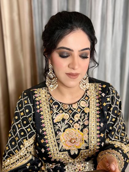 Elevate your glam with a bold black smokey eye paired with a soft nude finish. Perfect for making a statement.