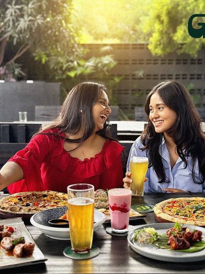 This picture is everything I want my venue to be: full of laughter, great food, and friends making memories together.