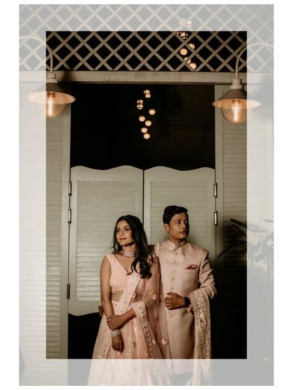 A stylish, editorial-style portrait of the couple, using dramatic lighting to create a sophisticated look.