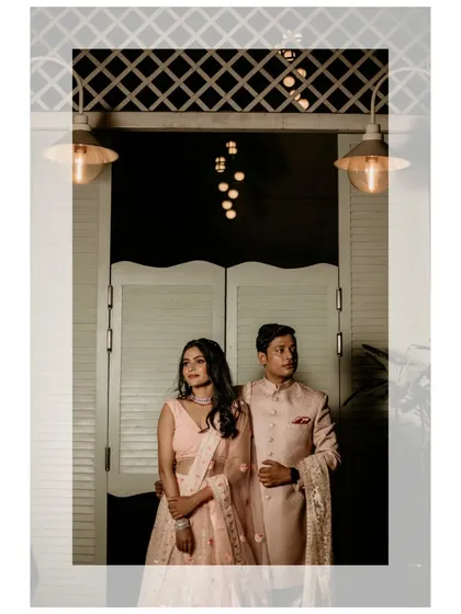 A stylish, editorial-style portrait of the couple, using dramatic lighting to create a sophisticated look.