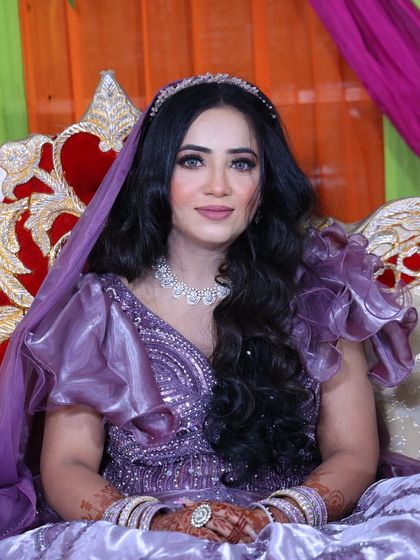 A portrait of the engagement bride in her lovely purple gown.