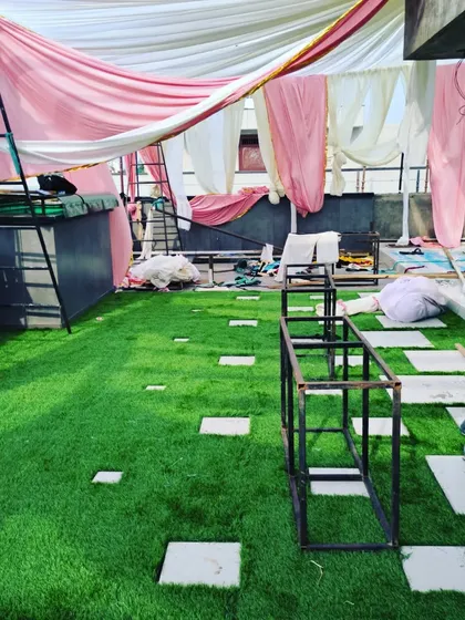 The full view of the rooftop event space coming together, with the artificial grass floor as the foundation.