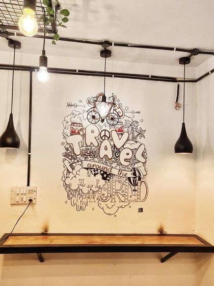 This travel themed doodle for Cafe Graffiters in Koramangala fits perfectly in this cozy corner. It's a great example of how our marker art can fill a small space with personality.