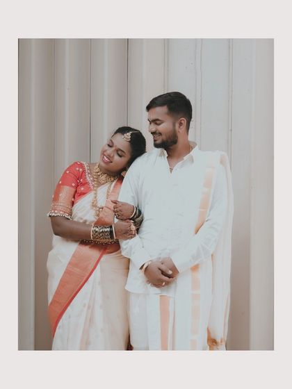 The bride leaning on the groom's shoulder, a sweet and intimate moment between the newly married couple.