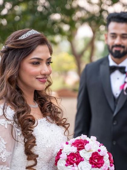 A vision of grace, love, and faith. This Christian bride's look was created without a trial, showcasing a soft glam style that's perfect for her white gown.