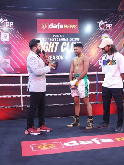 A post-fight interview in the ring. My fighters learn to handle themselves both inside and outside the ropes.