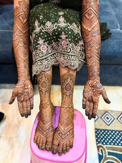 The complete picture of a full bridal mehendi session. This shows the extensive coverage I provide, ensuring you look like a queen on your wedding day.