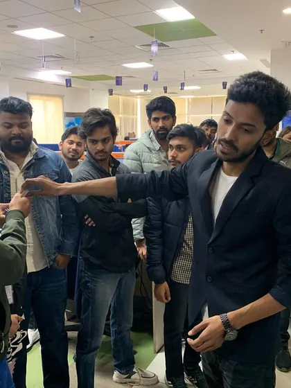 A moment of interaction with a volunteer from the audience during an office show. Audience participation is key to making the experience fun and inclusive for everyone.
