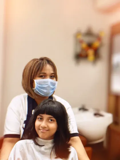 A fresh new look with bangs for this young client. We love creating cute and stylish haircuts for kids.