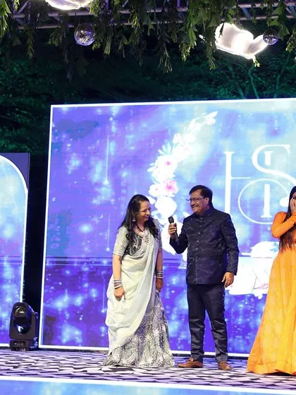 A candid shot of my surprised and happy reaction while interacting with the couple's parents on stage. Genuine moments are the best.