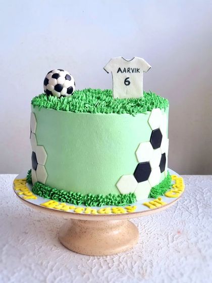 A full view of the whipping cream football cake. This design is a great example of a themed cake using a lighter frosting option.