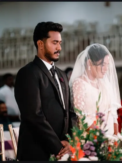 A solemn moment during a Christian wedding ceremony. We respectfully capture the prayers and vows that are central to your commitment.