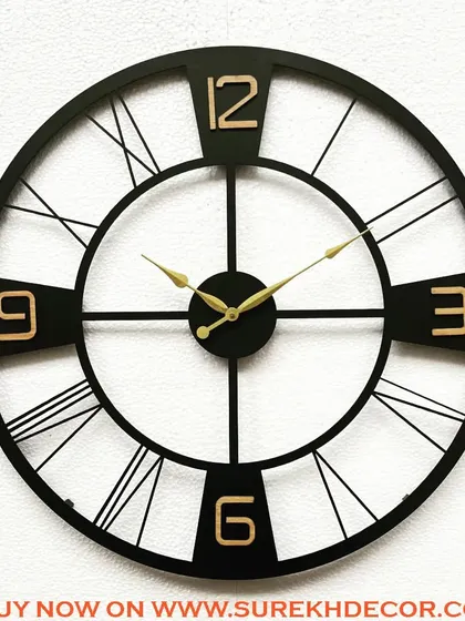A bold take on the vintage clock, this piece features prominent Arabic and Roman numerals in a striking design. The black metal frame with gold-finished numbers creates a powerful visual contrast.