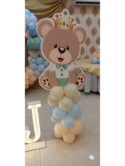 A close-up of the king teddy bear cutout, adding a royal touch to the welcome party.