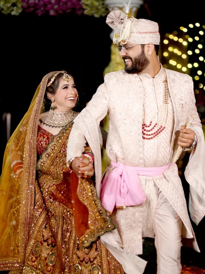 Another joyful, candid moment of the couple, capturing their genuine smiles and chemistry.