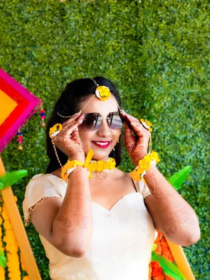 A fun and stylish portrait of the bride in her sunglasses. The Haldi ceremony is a celebration, and I make sure the photos reflect that joyful energy.