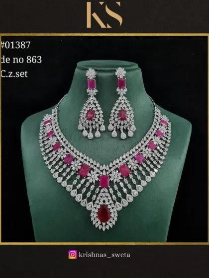 The C.Z. set in a bold ruby red. This is a glamorous and eye-catching piece that is perfect for making a statement.