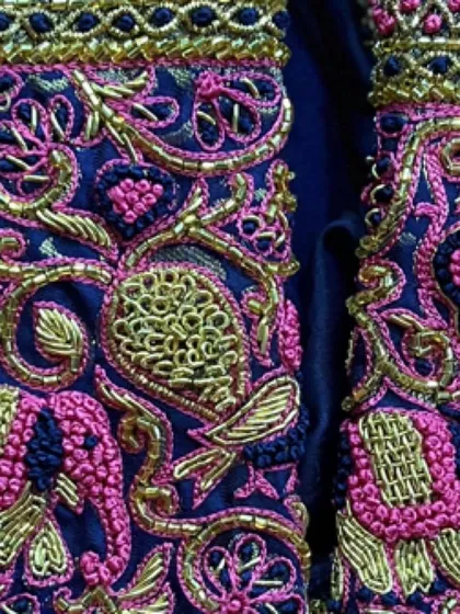 The full view of the sleeve cuff, where different traditional patterns and motifs come together to create a rich and layered design.