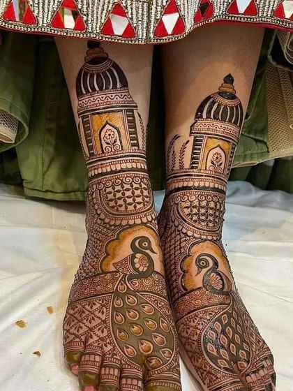 Both feet together, showcasing the symmetrical beauty of the architectural peacock design.