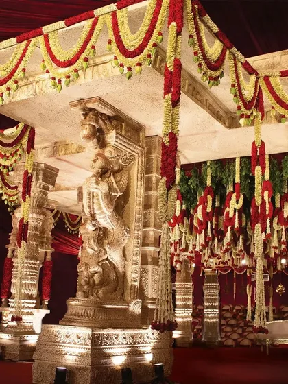 Here you can see the majestic lion pillars, a direct inspiration from Hampi's iconic structures. These motifs symbolize strength and protection, adding a regal and deeply symbolic touch to the sacred rituals.