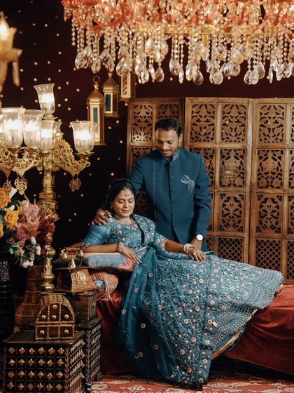 An intimate moment on a royal-themed set, with the groom looking lovingly at the bride.