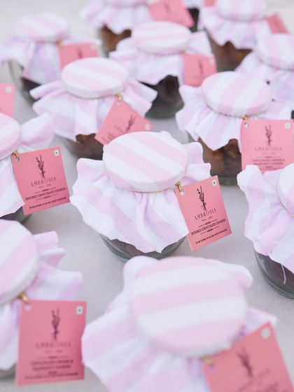 Our chocolate chunk and hazelnut cookie jars, beautifully wrapped for a celebration. A sweet and special party favour.