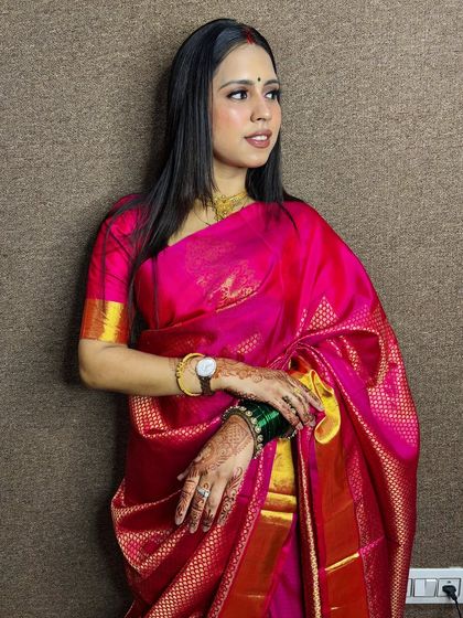 A side profile of the client, showing her sleek, straight hair.