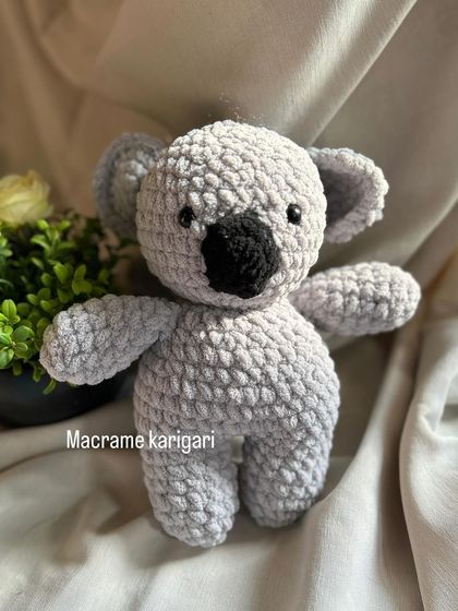 Another shot of our adorable crochet Koala. Its simple, round features make it irresistibly cute and cuddly.