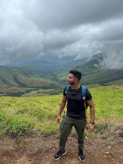 Taking a moment to admire the stunning valley views at Kudremukha. The landscape here is a photographer's dream.