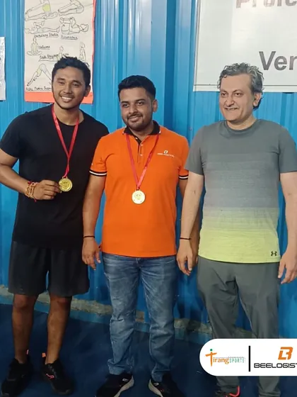 The gold medal winners from the Bee Logistics corporate tournament, celebrating their victory.