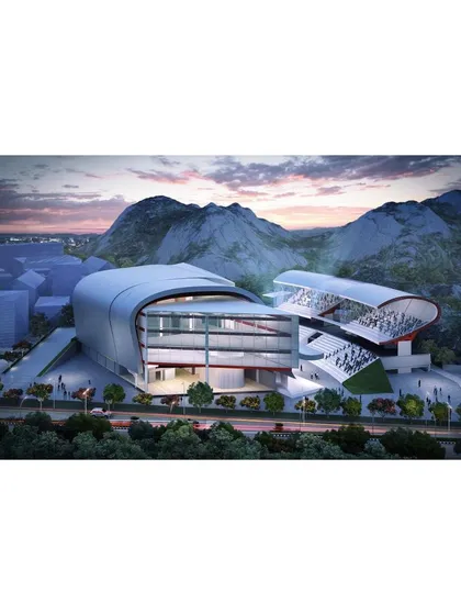 The roof form is a functional derivative of the need for a large cantilever over the outdoor competition arena, which fuses with the enclosed indoor gym. The public facilities and cafe are housed below the stilted viewing gallery.