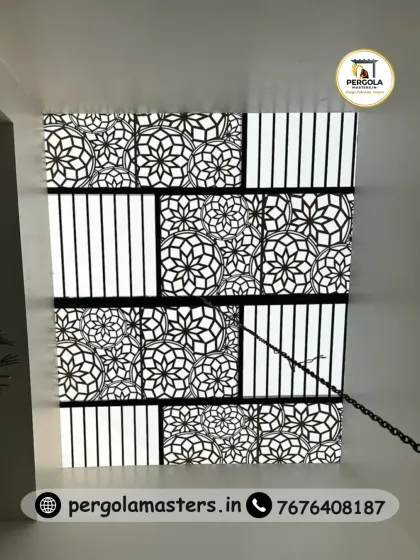 A large skylight panel with a mixed pattern of floral CNC cuts and simple stripes. This creative combination adds visual interest and texture to the ceiling, creating a unique and custom lighting feature.