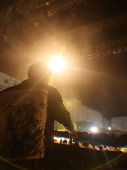 A silhouette shot against the bright stage lights at CU Fest. This captures the epic scale and atmosphere of my open air festival performances.