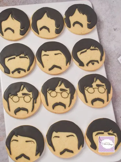 The Beatles-themed cookies, featuring the iconic hairstyles and moustaches of the Fab Four.