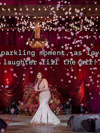 A sparkling moment for a sparkling bride. We used a bubble machine and dramatic lighting to create this beautiful, celebratory shot during the bride's solo performance.