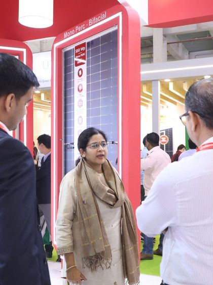 Our team discussing the technical details of our Mono PERC Bifacial modules with an attendee on Day 1 of the REI Expo.