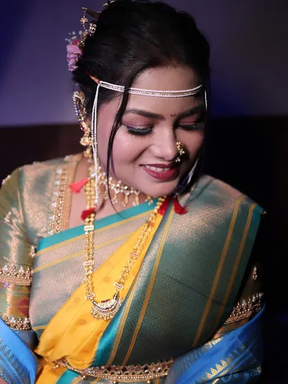 A soft, downward glance from the bride. This highlights her beautiful eye makeup and the delicate details of her look.