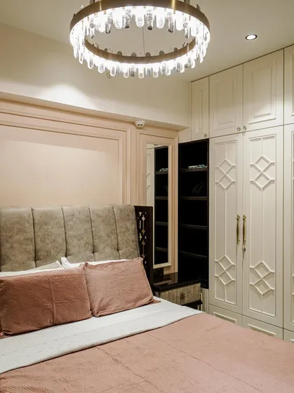 A different angle of the bedroom from image 46, showing the full wardrobe and dressing area.