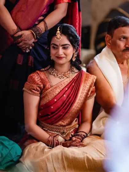 A candid shot of a bride-to-be during her engagement ceremony, surrounded by family. We focus on capturing the emotions of the day.